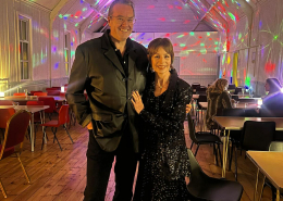 Steve and Chris with disco lights behind them