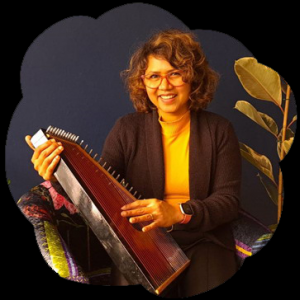 Photo of Amruta, holding her sitar